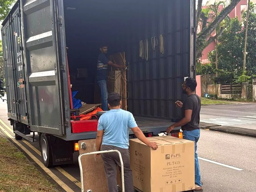 Casa Furnishing delivery lorry being unloaded on site in Singapore