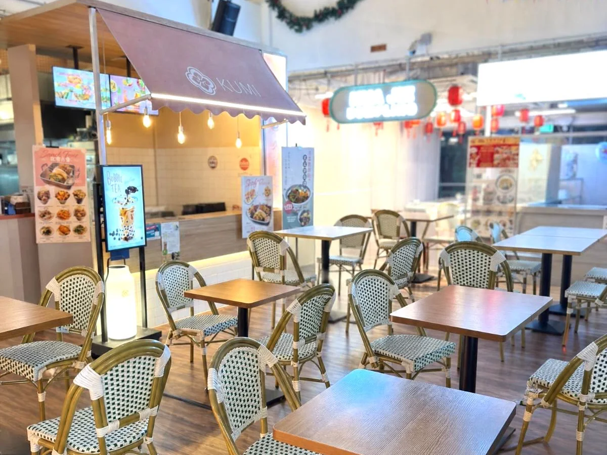 Food court seating with rattan bistro chairs and compact dining tables supplied by Casa Furnishing